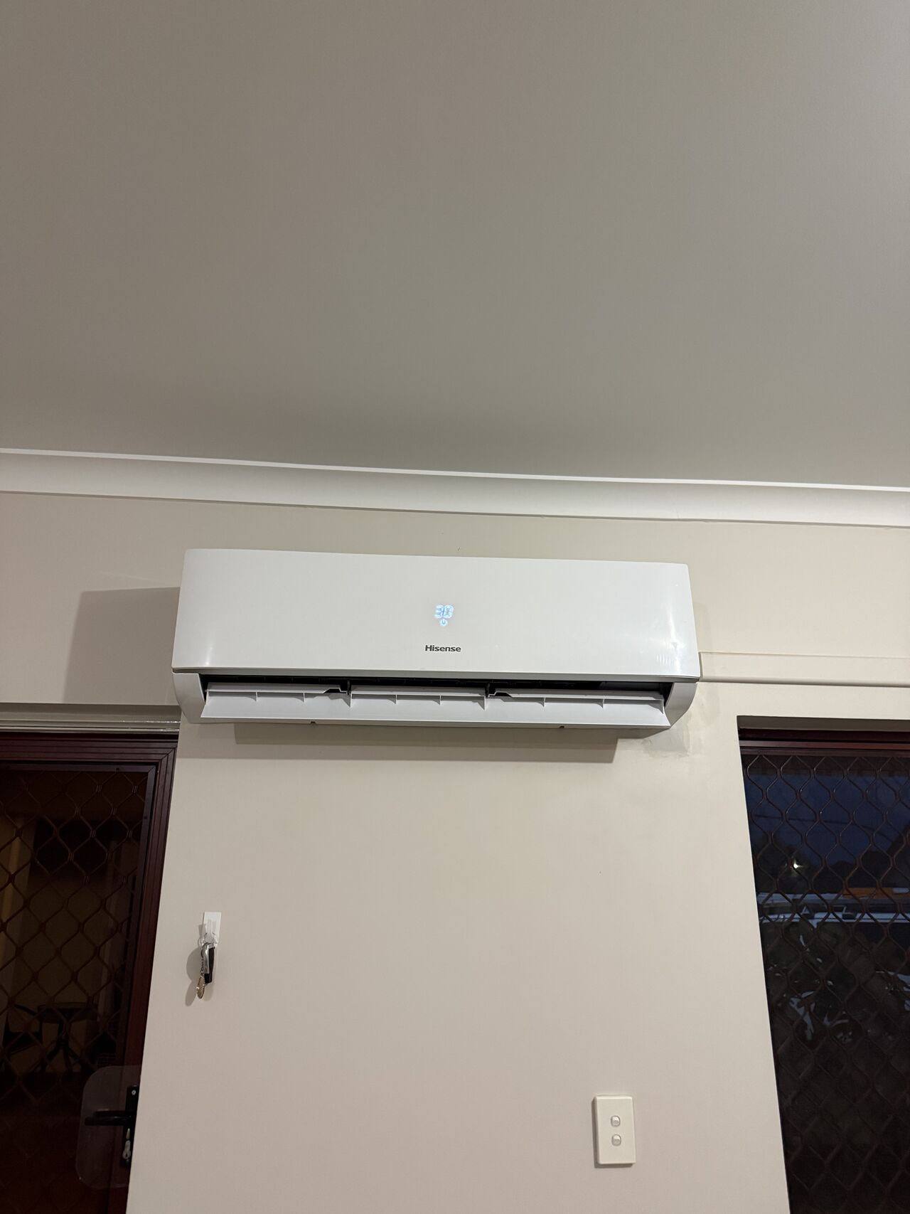 Split system head installed above a doorway in a Perth home