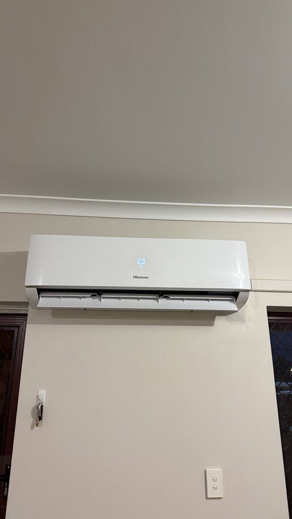 Split system head installed above a doorway in a Perth home