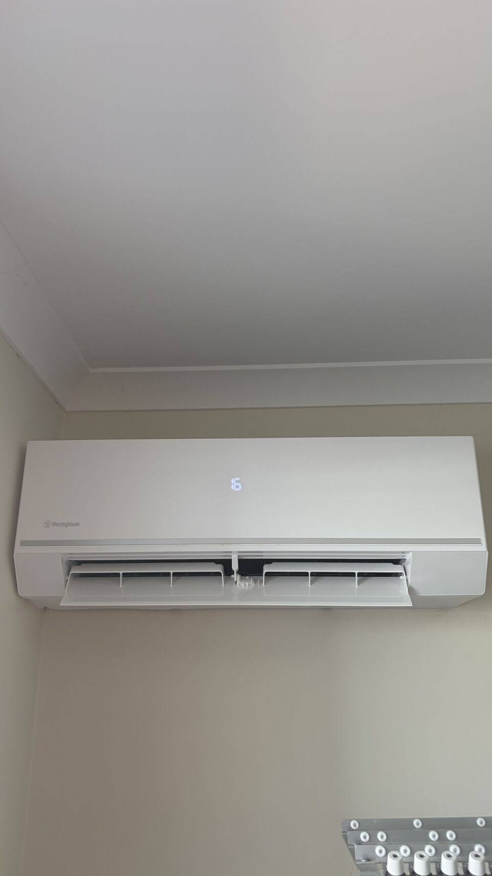 Split system head installed high on a wall in a Perth home